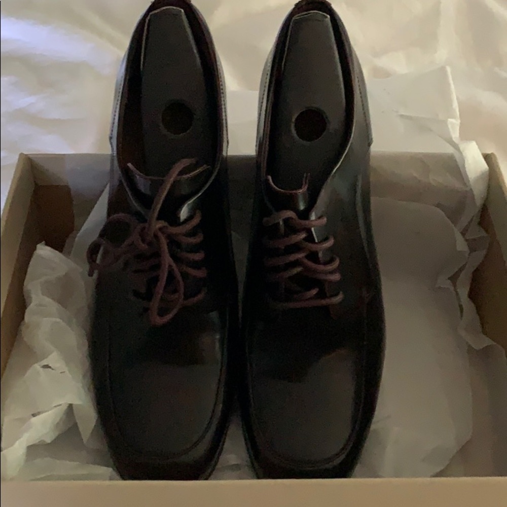Clark’s brown high heeled oxfords. Never worn.
